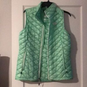 mint green north face women’s puffer vest
